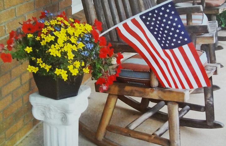 A patriotic scene on the porch of an apartment