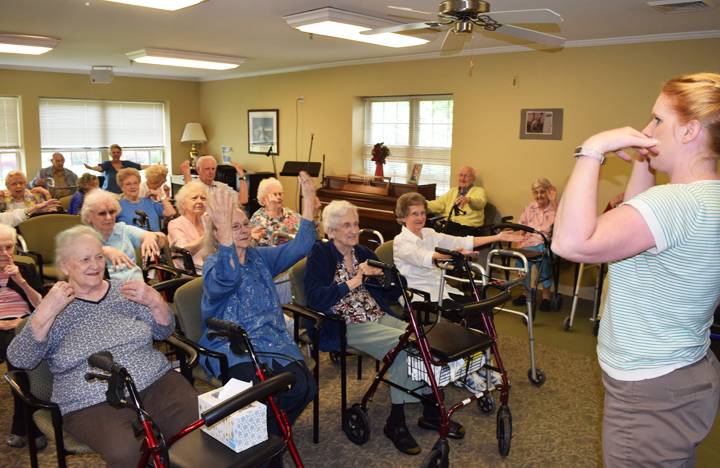 Residents take part in an exercise class with the Activities Director