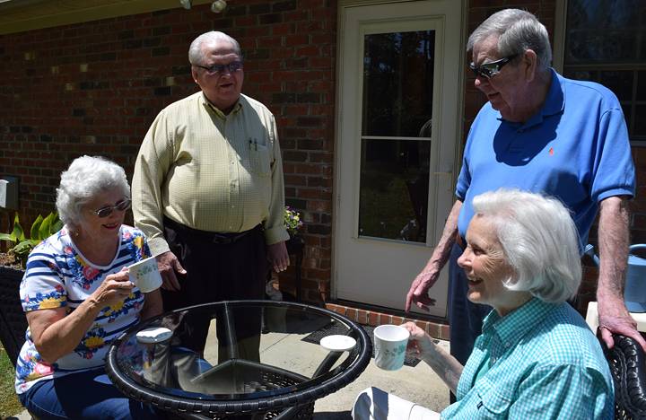 Some Independent Living residents enjoy some time on their outdoor patio