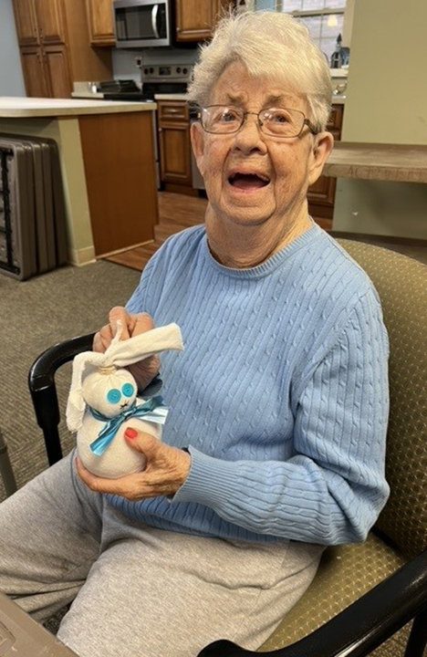 An Assisted Living Resident shows off her craft