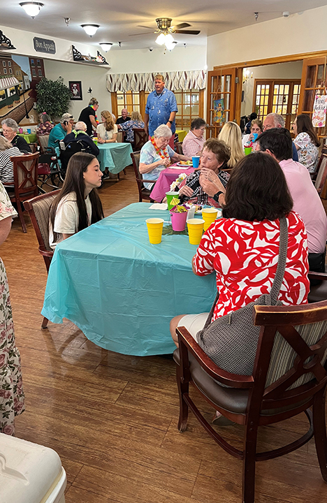 Memory Care residents enjoy a luau