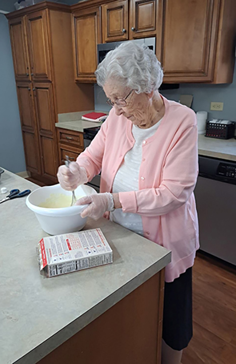 An Assisted Living Resident enjoying some cooking time